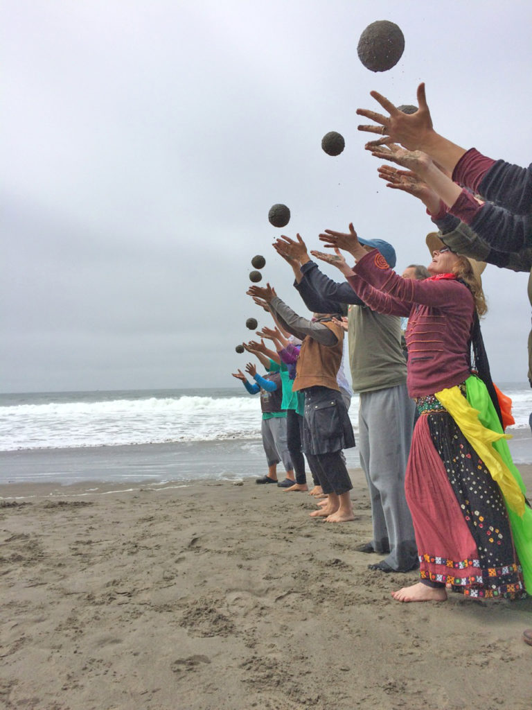A group tossing sand globes together at an Earth Day celebration on Stinson Beach, 2015
Photo: Amy Pertschuk