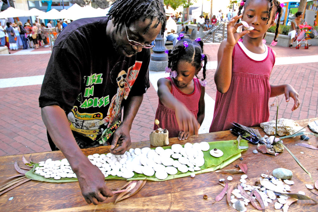 A family creating with nature at the Art and Soul festival in Oakland, California, 2007